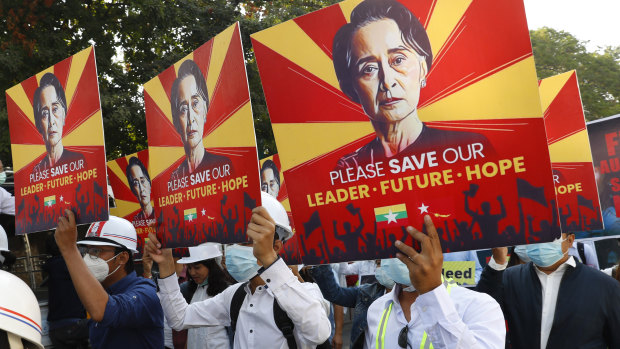 Engineers hold posters with an image of deposed Myanmar leader Aung San Suu Kyi as they hold an anti-coup protest march in Mandalay on Monday.