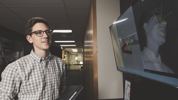 Seeing Machines head of advanced engineering John Noble, pictured demonstrating the company's eye-tracking system.