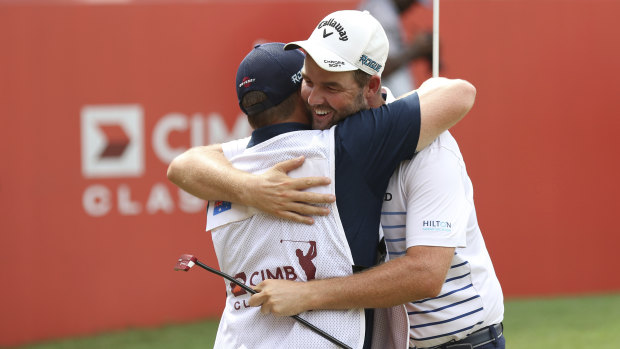 Million-dollar smile: Marc Leishman celebrates his US PGA Tour victory in Malaysia.