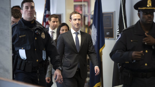 Facebook chief executive Mark Zuckerberg leaves a meeting with US senators on Monday ahead of his appearance before US Congress.
