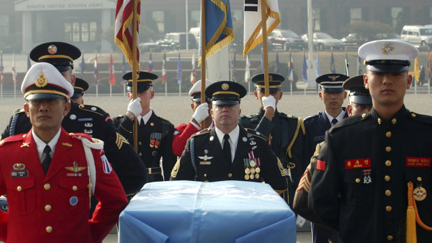 United Nations Command soldiers stand around the coffin during an honor guard departure ceremony in South Korea. One outcome of the summit between President Donald Trump and North Korean leader Kim Jong Un was the commitment to recover the remains of US military personnel missing-in-action from the Korean War.