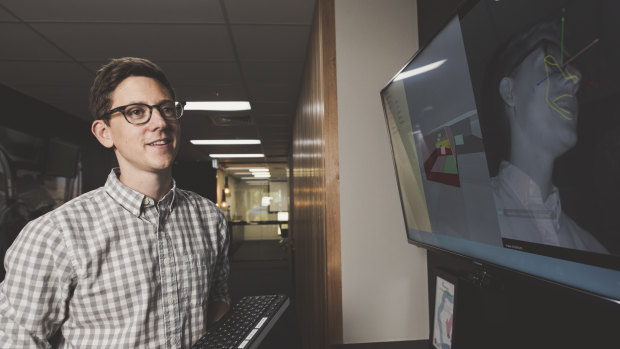 Seeing Machines head of advanced engineering John Noble, pictured demonstrating the company's eye tracking system.