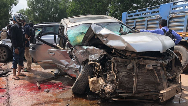 Cambodian Prince Norodom Ranariddh's mangled car sits on the side of a road after a collision with another vehicle outside Sihanoukville, Cambodia, on Sunday.