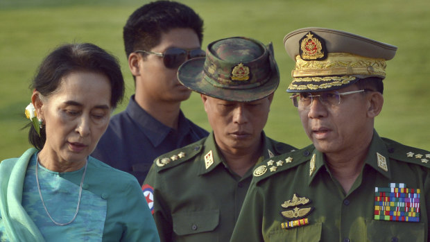 Military officers said that leader Aung San Suu Kyi, left, ordered security forces to launch the offensive against the Arakan Army.