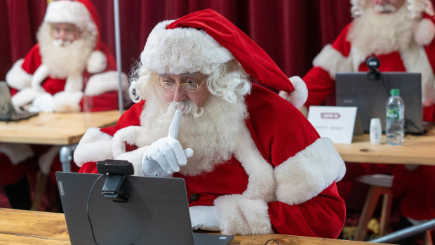 A Santa comes to grips with video technology during a Ministry of Fun training course in London. 