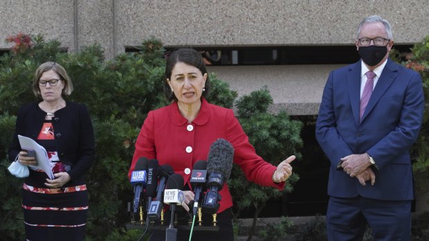 NSW Premier Gladys Berejiklian, with Chief Health Officer Kerry Chant and Health Minister Brad Hazzard, announce the easing of Sydney's lockdown restrictions for the Christmas period on Wednesday. 