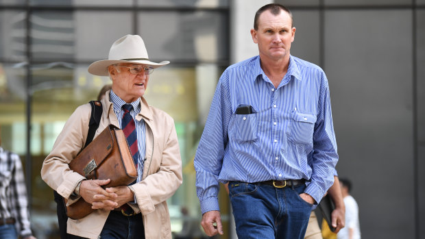 Charleville grazier Dan McDonald (right), accompanied by the federal member for Kennedy Bob Katter, outside the District Court in Brisbane on Tuesday.