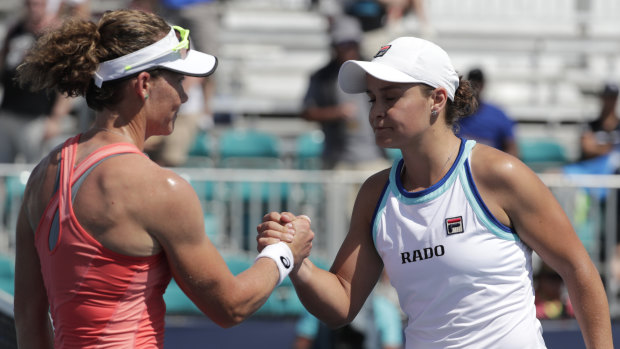 Compatriots: Ashleigh Barty and Samantha Stosur shake hands in Miami.