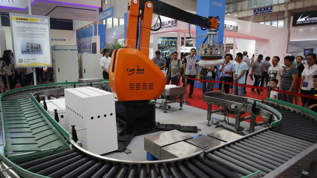 An industrial robot demonstration in Beijing. Industrial robots are among the Chinese products targeted for tariffs.