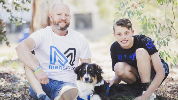 Peter "Cookie" Davis of Menslink with Lachlan Kelly Hammond, 16, and his soon-to-be assistance dog Koda.