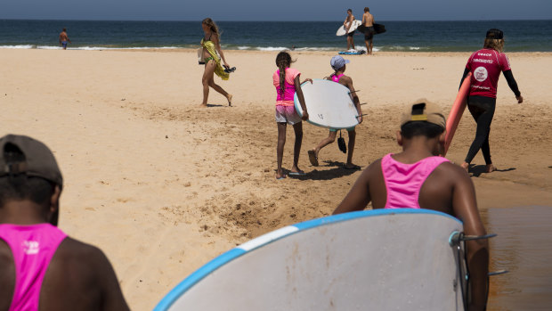 The kids took to the beach and wasted no time grabbing a surf board to paddle out at Long Reef. 