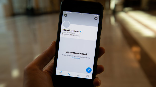 The suspended Twitter account of US President Donald Trump on a smartphone.