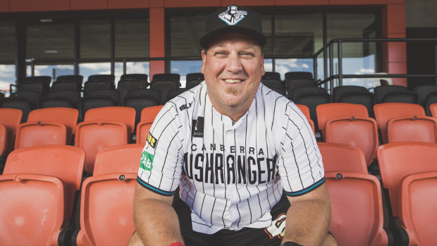 Canberra Cavalry coach Michael Wells wears the replica of the Canberra Bushrangers uniform from the 1990s.