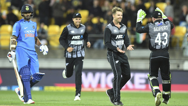 Commanding: New Zealand players celebrate a wicket in their crushing victory over India.