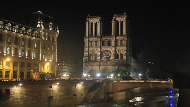 Notre Dame Cathedral is lit up in Paris.
