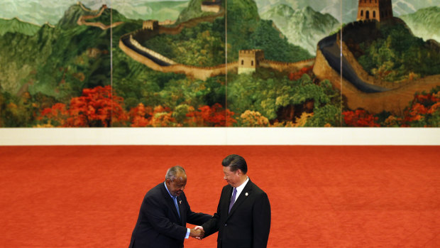 Djibouti's President Ismail Omar Guelleh, left, shakes hands with Chinese President Xi Jinping during the Forum on China-Africa Cooperation in Beijing last year.