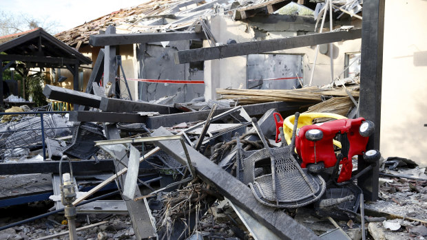 A house lies in ruins after being hit by a rocket in Mishmeret, central Israel, on Monday.