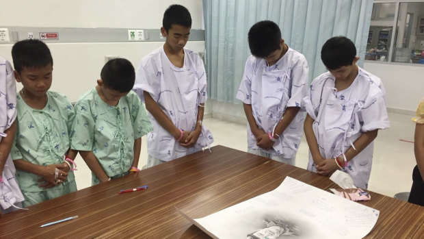 Some of the boys rescued from the Tham Luang cave pay their respects to former navy SEAL Saman Gunan.