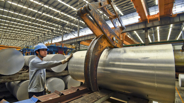 A worker transfers an aluminium product at a factory in Nanning in south China's Guangxi Zhuang Autonomous Region.