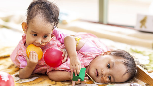 Nima and Dawa play together ahead of their surgery.