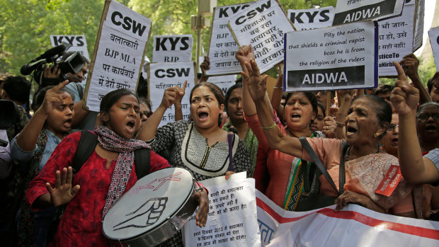 Indian students and activists participate in a protest against recent cases of rape in the country.