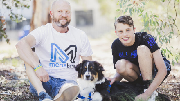 Peter "Cookie" Davis of Menslink with Lachlan Kelly Hammond, 16, and his soon-to-be assistance dog Koda.