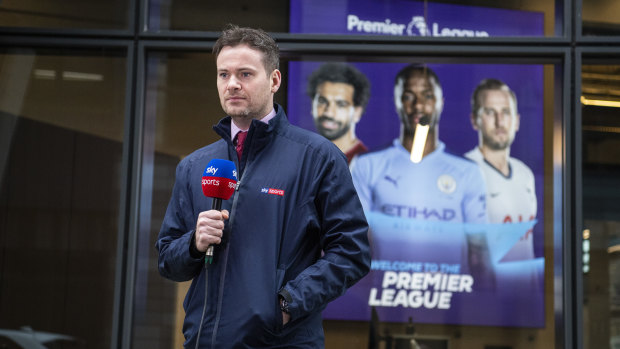 A sky sports presenter speaks to camera outside the Premier League headquarters on March 19 as clubs and officials met to discuss plans for the remainder of the season.