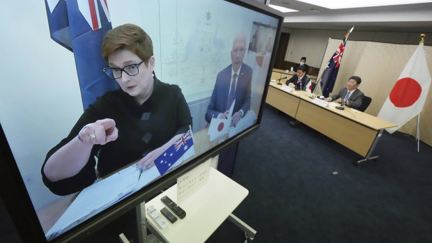 Foreign Minister Marise Payne and Defence Minister Peter Dutton, on screen, attend a video conference with Japan’s Foreign Minister Toshimitsu Motegi and Defence Minister Nobuo Kishi on Wednesday.