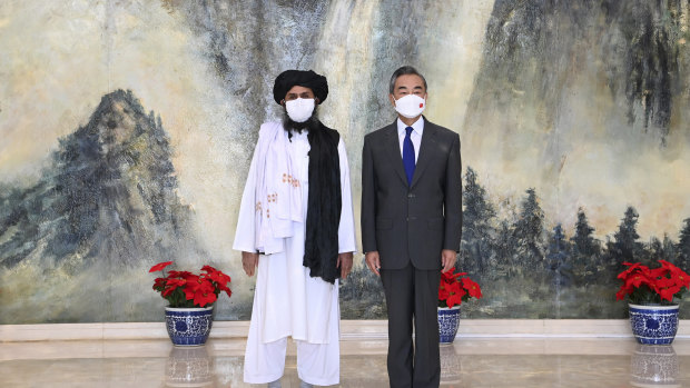 Taliban co-founder Abdul Ghani Baradar, left, and Chinese Foreign Minister Wang Yi in Tianjin, China.