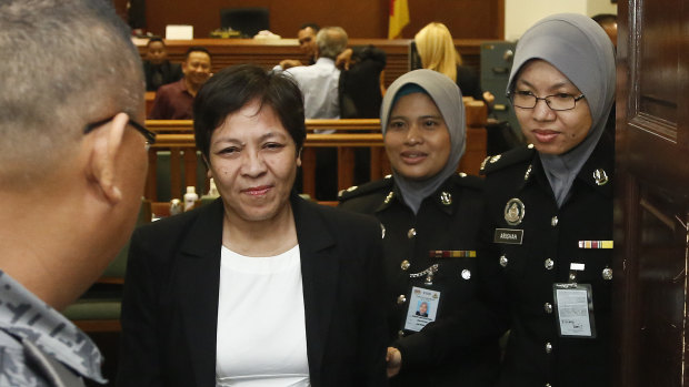 Australian Maria Elvira Pinto Exposto, second left, leaves her hearing at the Shah Alam High Court after being found not guilty last year.