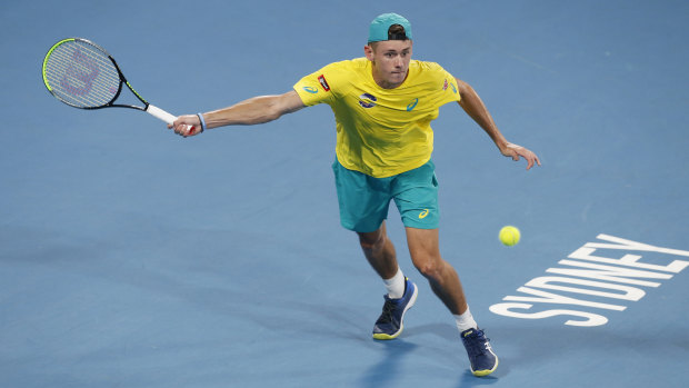 Stretched: Alex de Minaur in action for Australia in the ATP Cup.