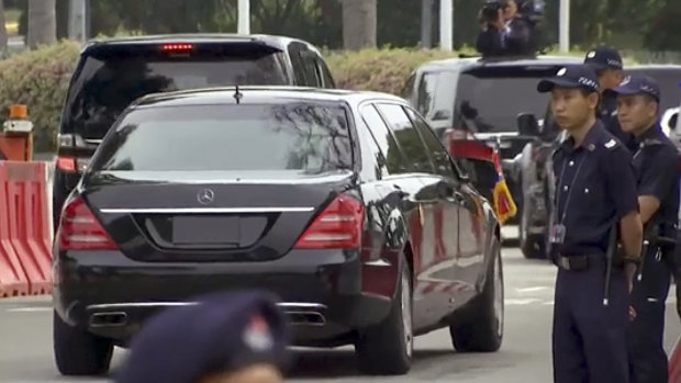 A large Mercedes limousine with a North Korean flag believed to be carrying North Korean leader Kim Jong-un is driven on a street in Singapore last year.