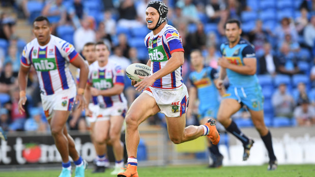 Runaway: Kalyn Ponga streaks away for a length-of-the-field try for Newcastle.