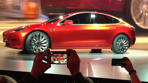 Tesla 'real car company' after hitting Model 3 goal, Elon Musk says