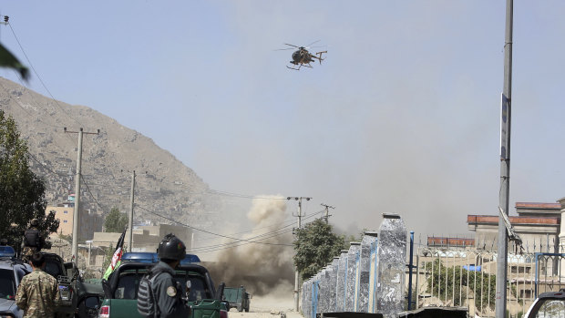 An MD 530F military helicopter targets a house where suspected attackers are hiding in Kabul, Afghanistan, on  August 21, 2018. 