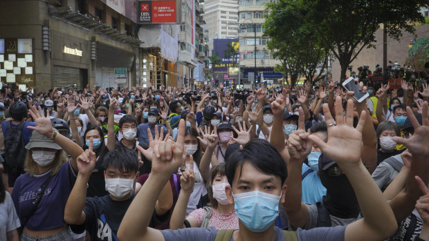 Hongkongers protest against new security laws in the former UK colony.