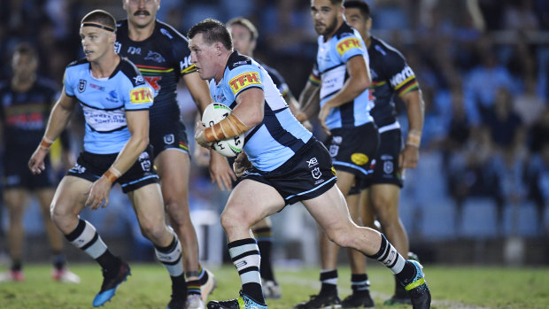 He's back: Paul Gallen charges into the Panthers line.