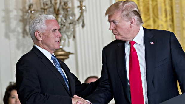 Mike Pence, seen here with Donald Trump, defended the administration’s foreign policy under tough questioning from Dick Cheney.