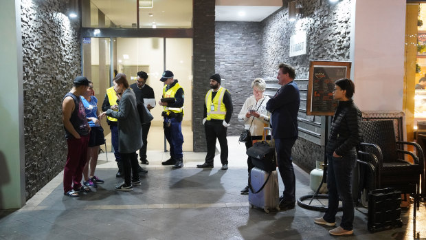 Residents evacuating the building on Friday night after receiving a letter from the building manager saying they had until 9pm to vacate the complex.