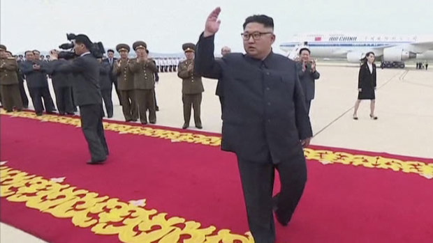 Kim Jong-un waves to hundreds of well-wishers as he returns to a grand red carpet homecoming this week.