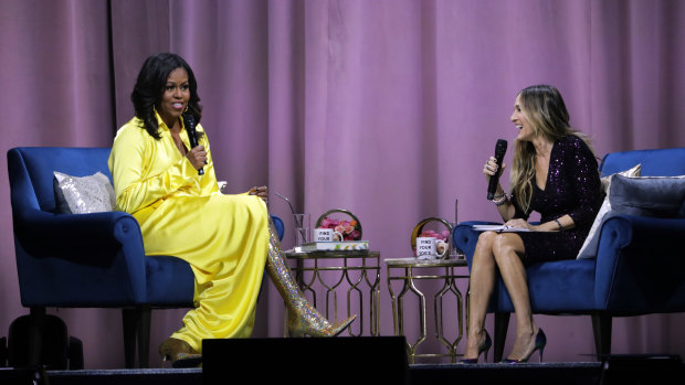 Former first lady Michelle Obama (left) wears the now famous Balenciaga boots for her interview with Sarah Jessica Parker about her book, 'Becoming'.