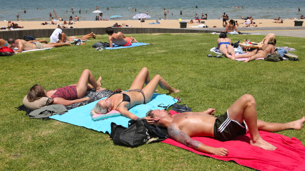 Beachgoers tried to find some relief at the St Kilda foreshore on Thursday. 