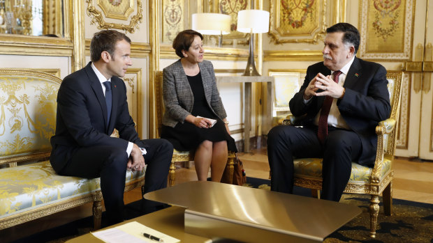 French President Emmanuel Macron (left) and Libyan Prime Minister Fayez Sarraj (right) met in Paris in May to discuss a roadmap to elections in an effort to bring order to Libya's political chaos, which is feeding Islamic militants and instability, and providing a corridor for African migration to Europe.