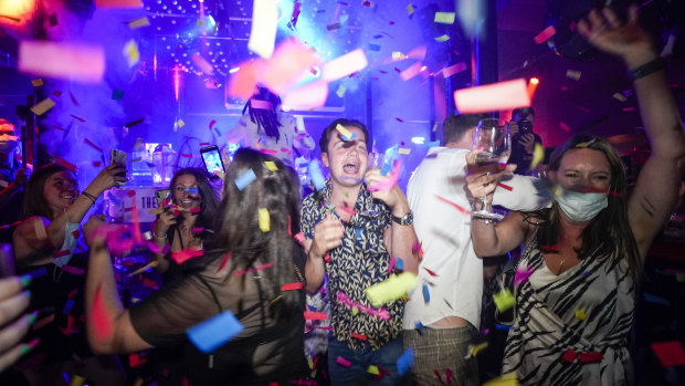 Londoners celebrated the end of restrictions at nightclubs and bars.
