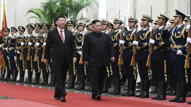 Chinese President Xi Jinping, left, and North Korean leader Kim Jong-un during a welcome ceremony at the Great Hall of the People in Beijing.
