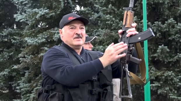 Belarus President Alexander Lukashenko armed with a Kalashnikov-type rifle near the Palace of Independence in Minsk, Belarus.