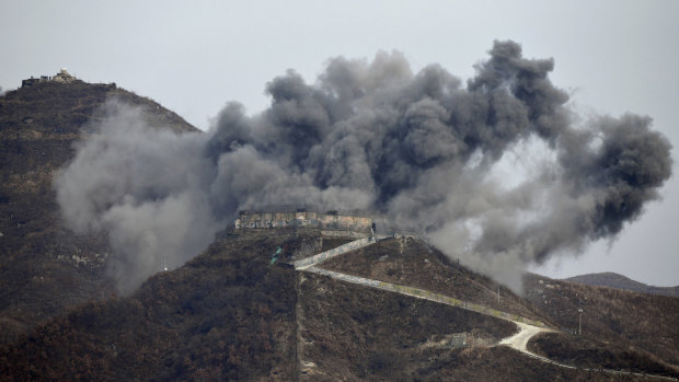 Smoke from an explosion rises last month as part of the dismantling of a South Korean guard post in the Demilitarized Zone dividing the two Koreas.