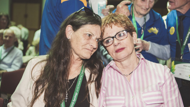 Sisters Josephine Littlehawk and Katie Kellegher reunited at the national apology to victims and survivors of institutional child abuse at Parliament House on Monday.