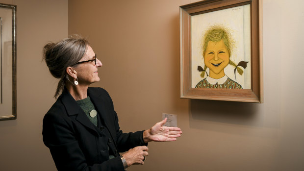 Charlotte Brack (daughter of artist John Brack) with her portrait.