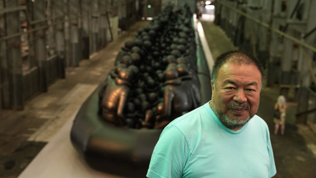 Chinese contemporary artist and activist Ai Weiwei poses in front of 'Law of the Journey, 2017'.